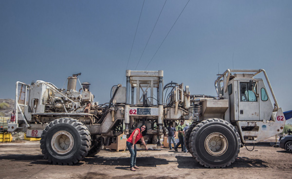 Liat R. Shindler (Zion geophysicist) in front of 30 ton Mertz Vibroseis Vehicle