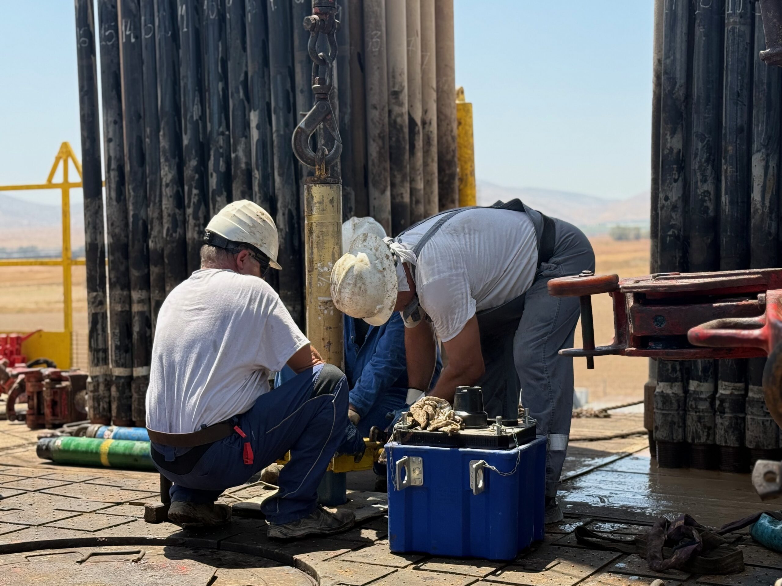 MJ-02 crew working together on the rig floor