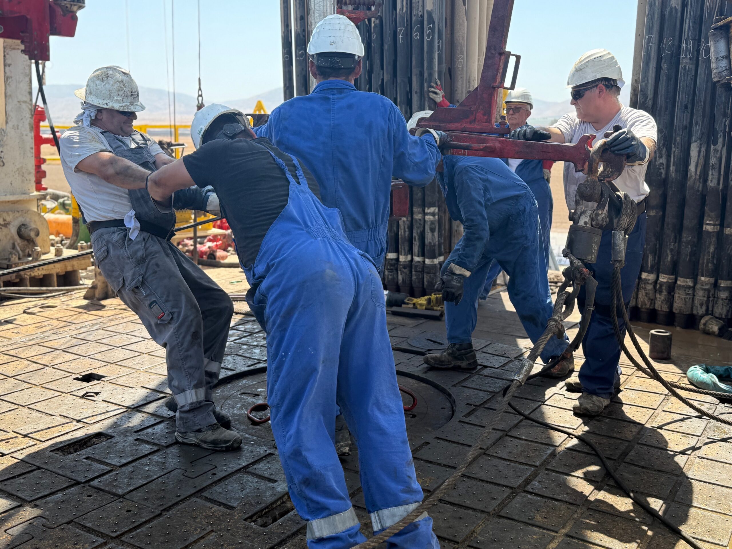 MJ-02 field crew working together at the rig