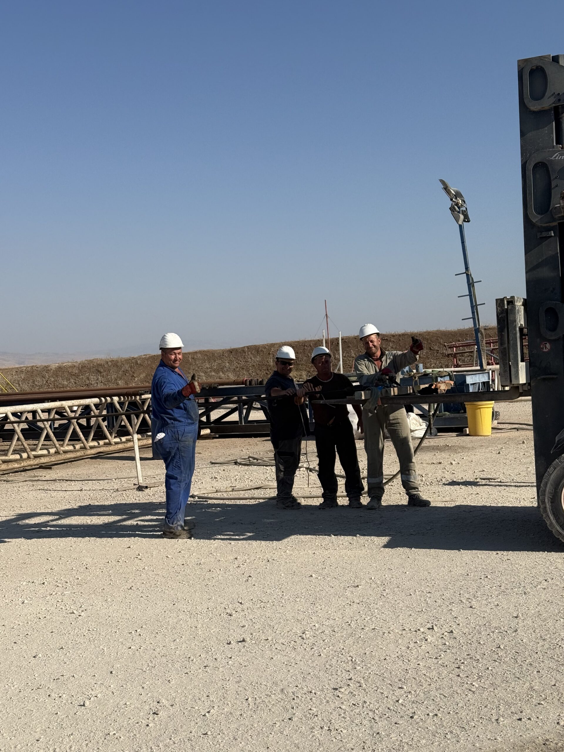 MJ-02 crew members beside site equipment