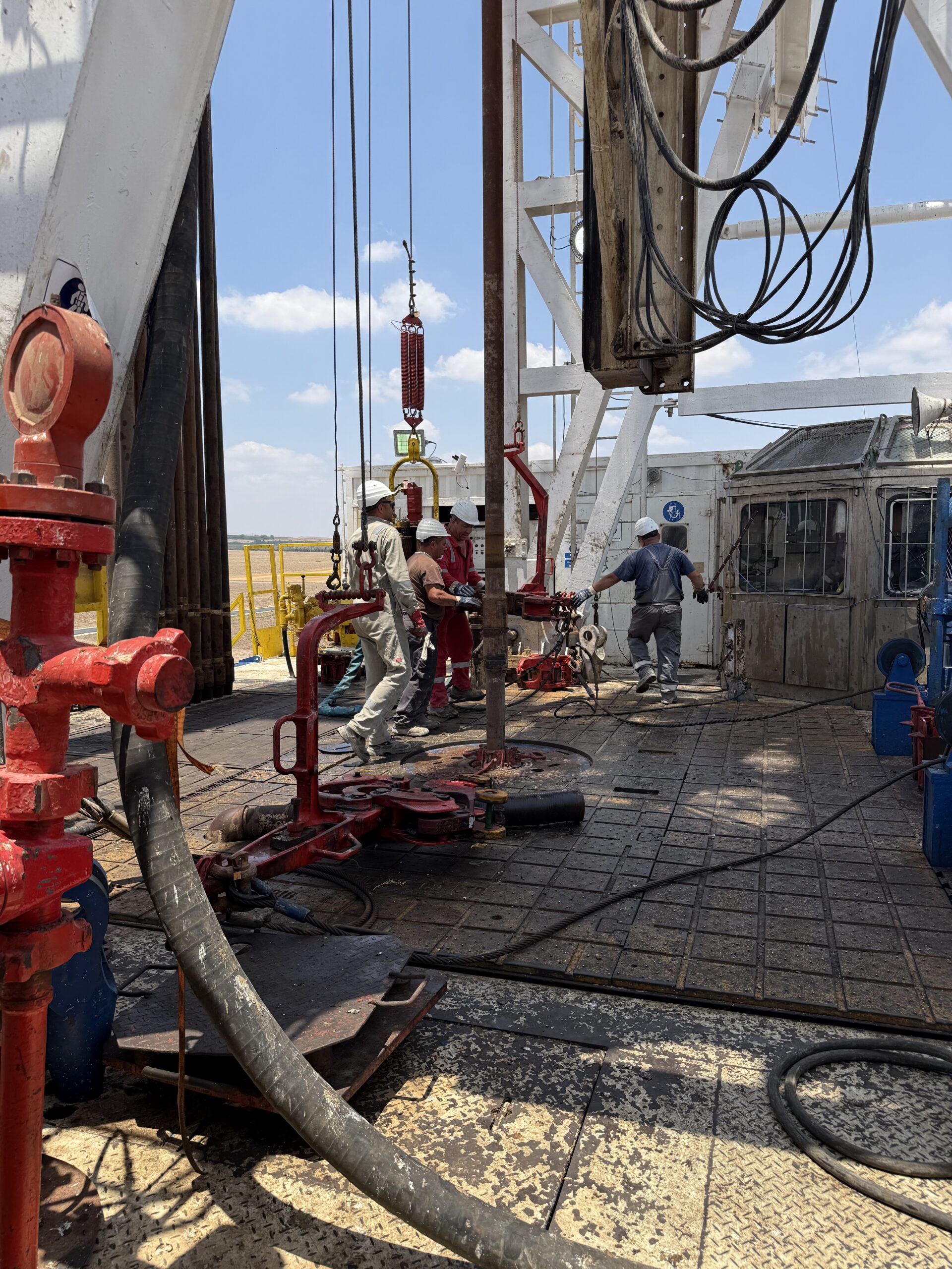 MJ-02 crew coordinating work on the rig floor