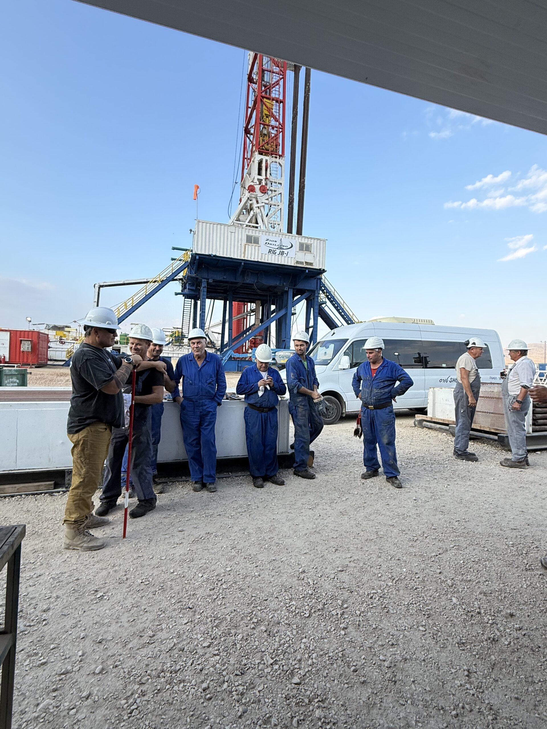 MJ-02 crew members gathered beside the drilling rig