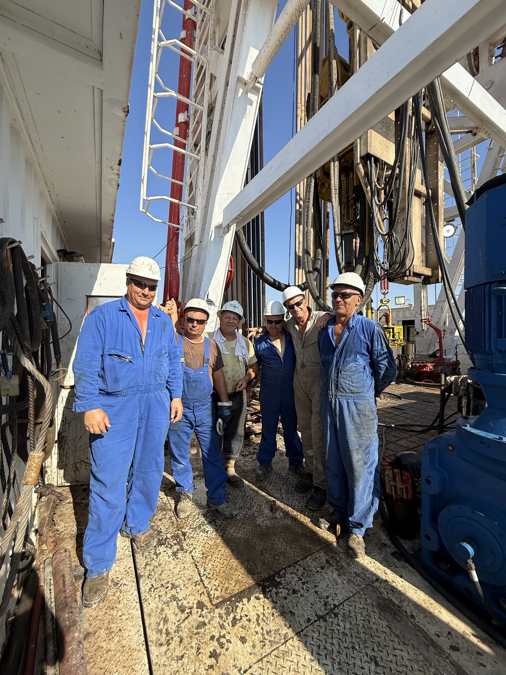 MJ-02 crew members together on the rig floor