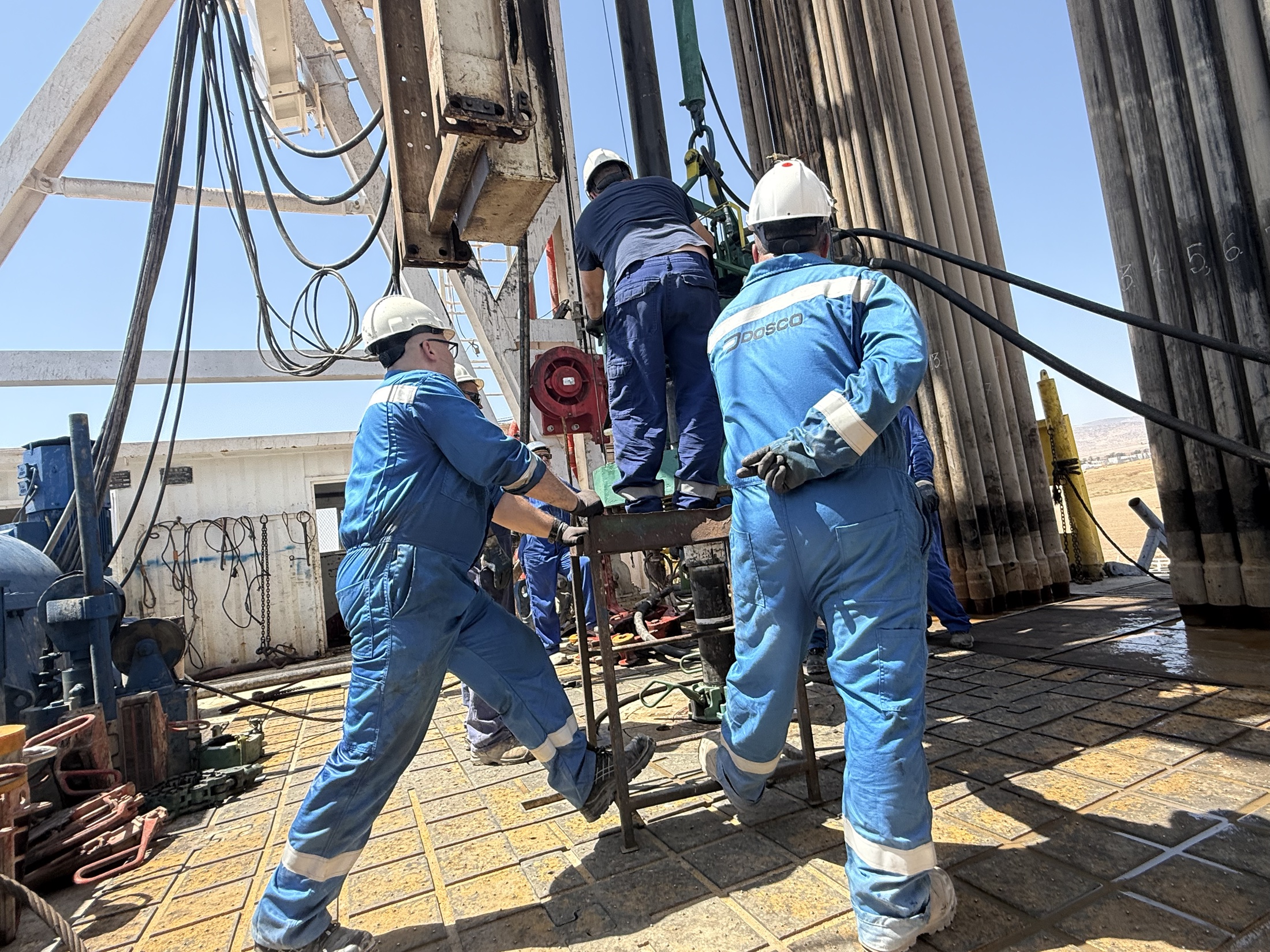 MJ-02 crew working together at the drilling rig
